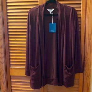 New.  The color is burgundy.  Long sleeve with pockets